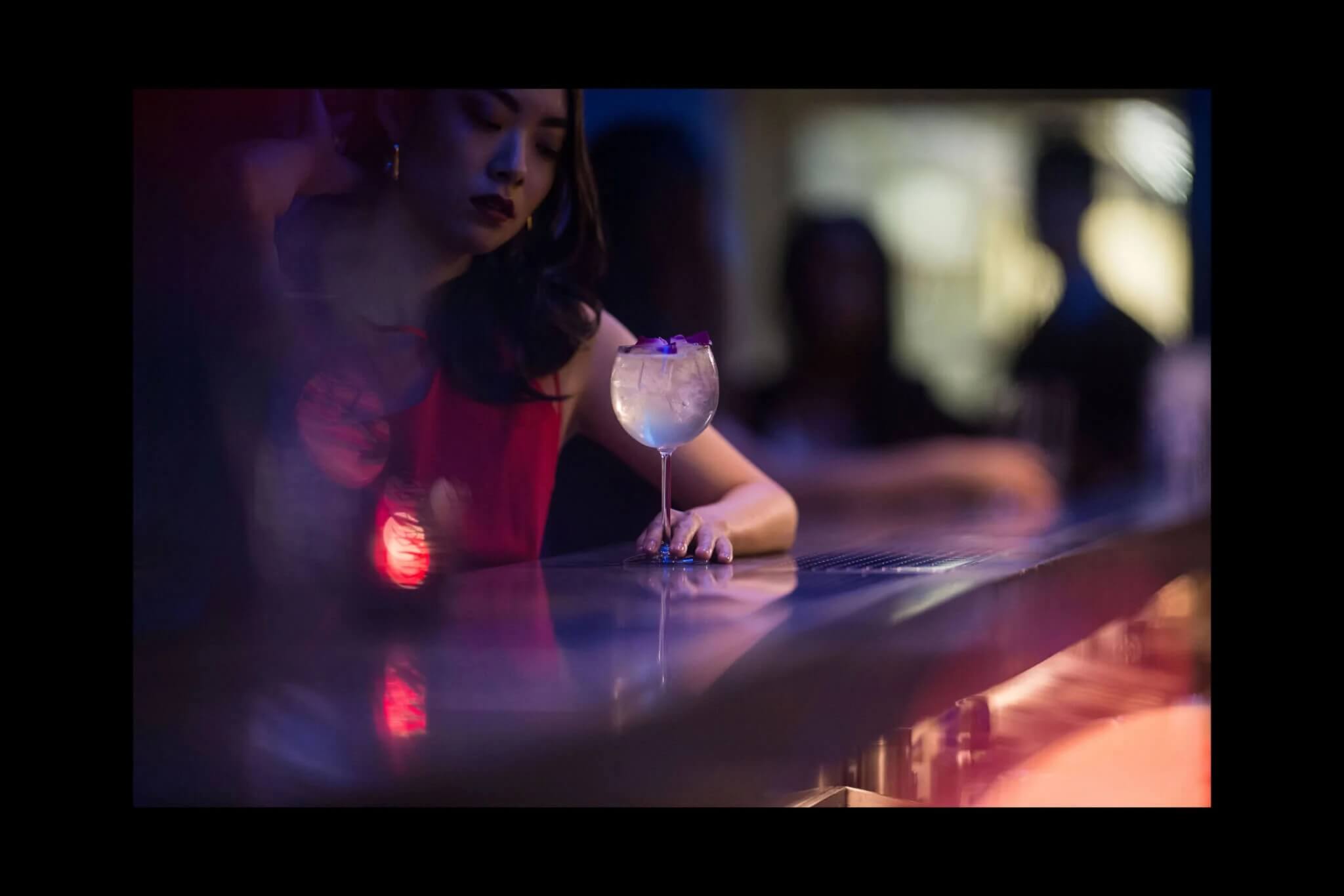 Woman at Bar with Cocktail