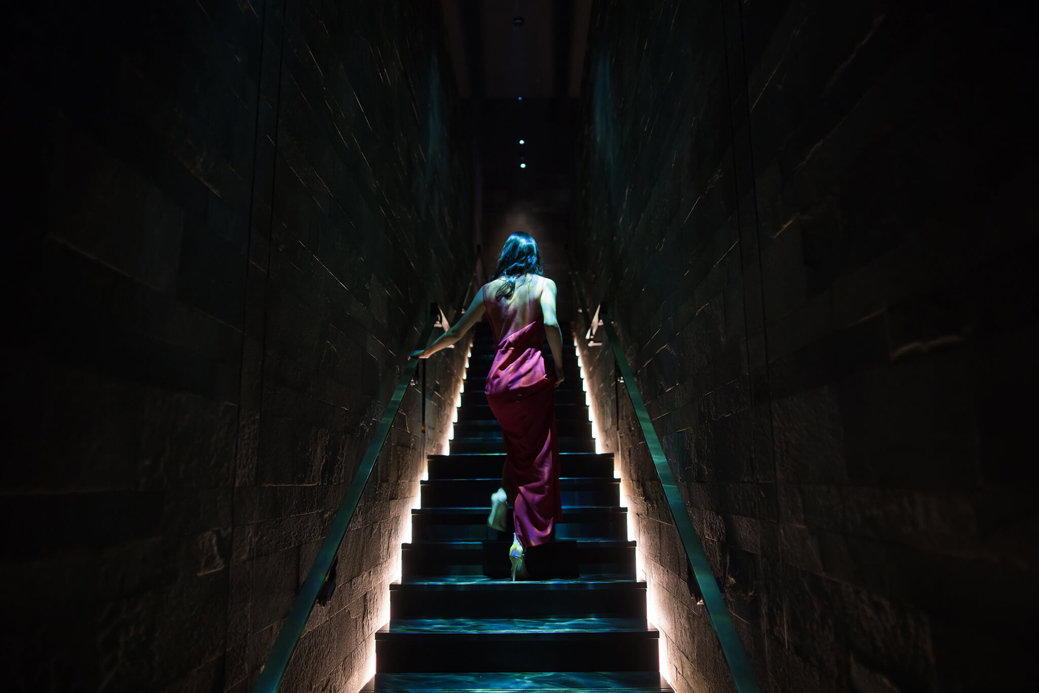 Girl walking up stairs at Hakkasan